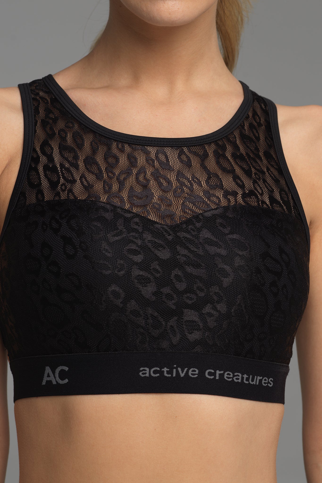 Treasure Chest sports bra in black animal print lace (front view)