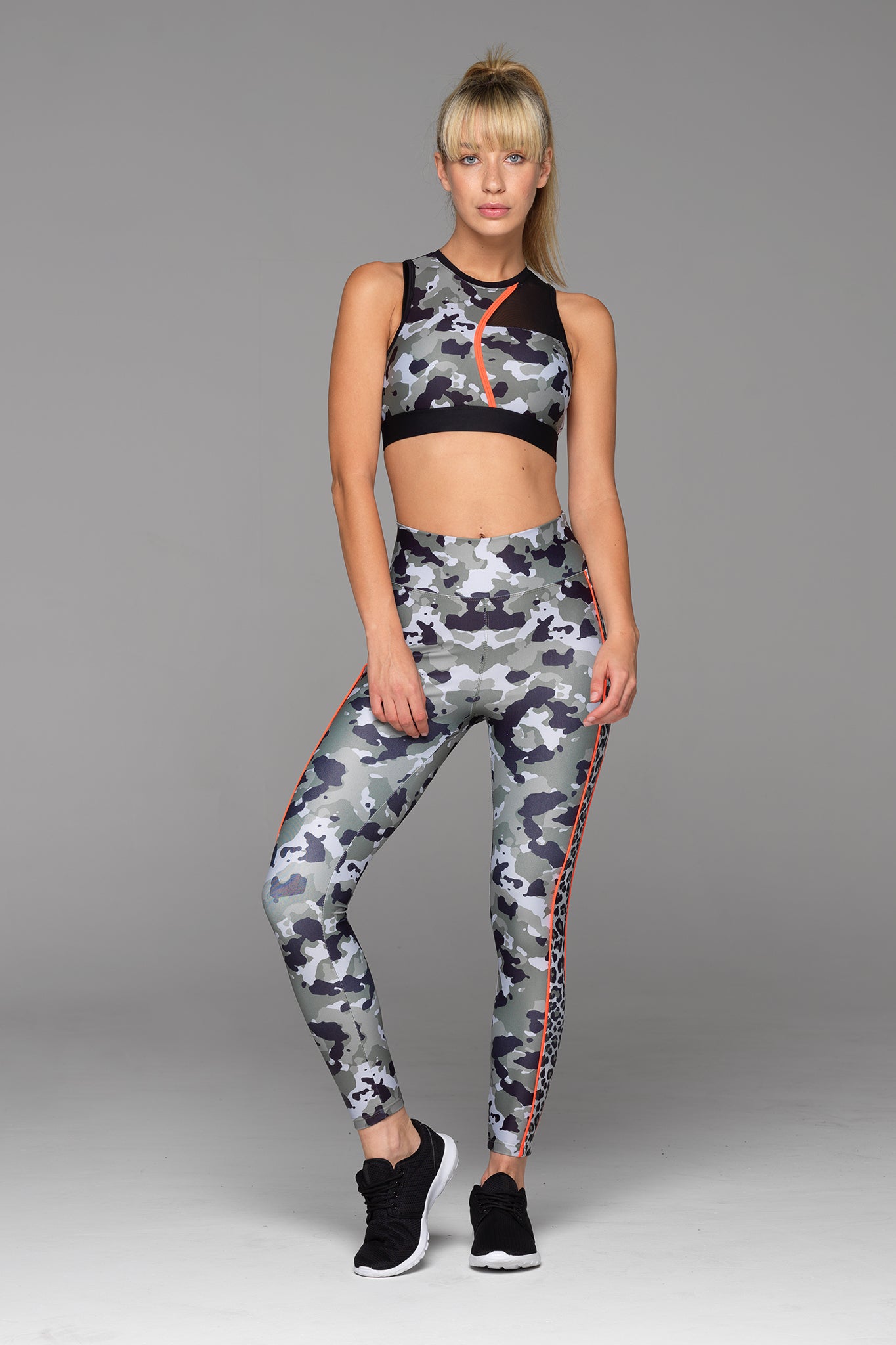 Our Charlie 7/8 Length Legging in Camo is ready for your next adventure. With its two-toned print and touch of vibrant orange, you won't be missed.