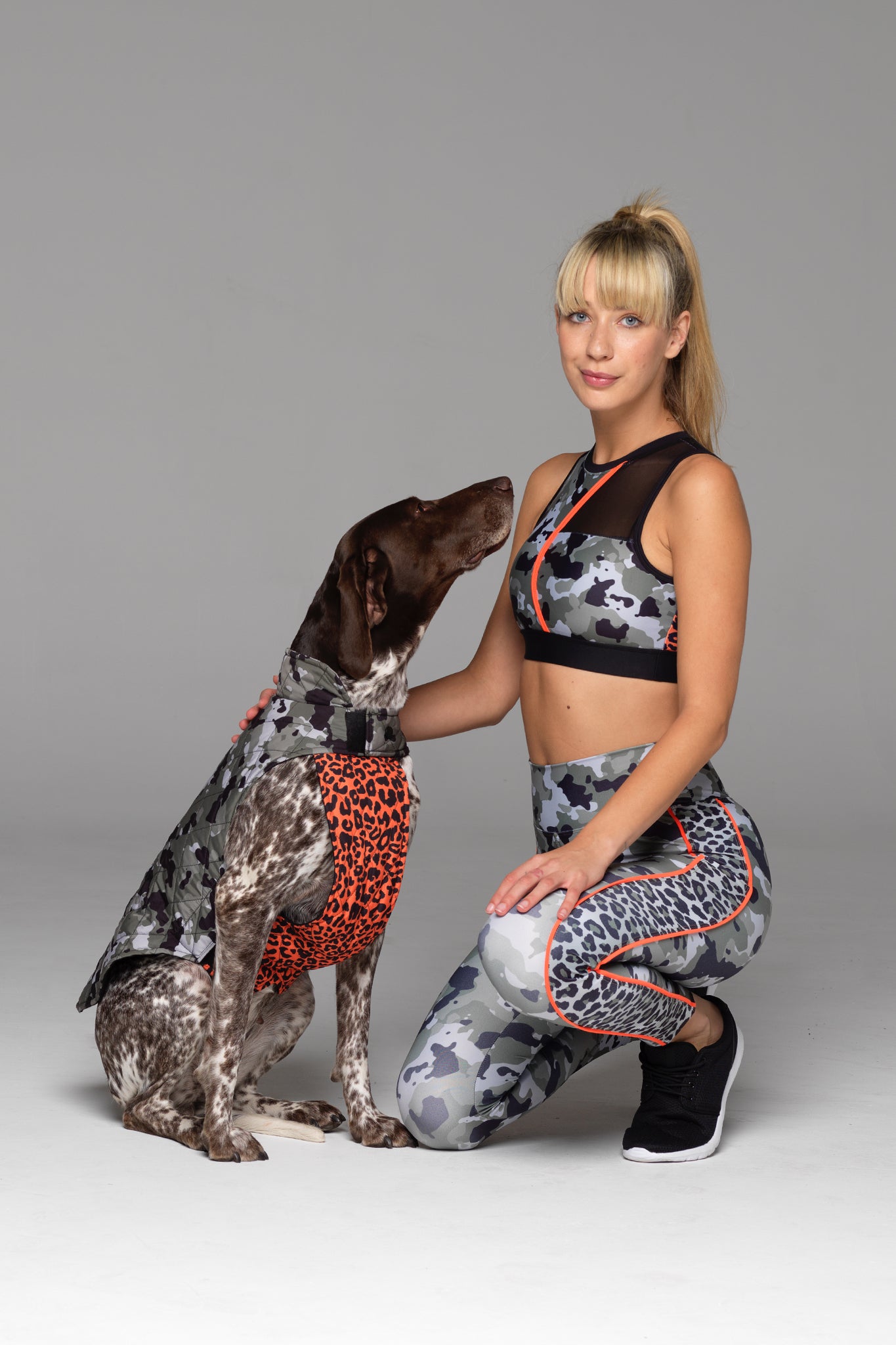 Time for Matchy-Matchy! Foxtrot Dog Jacket worn by dog model and matching Tour of Duty sports bra and Charlie 7/8 legging worn by human model.