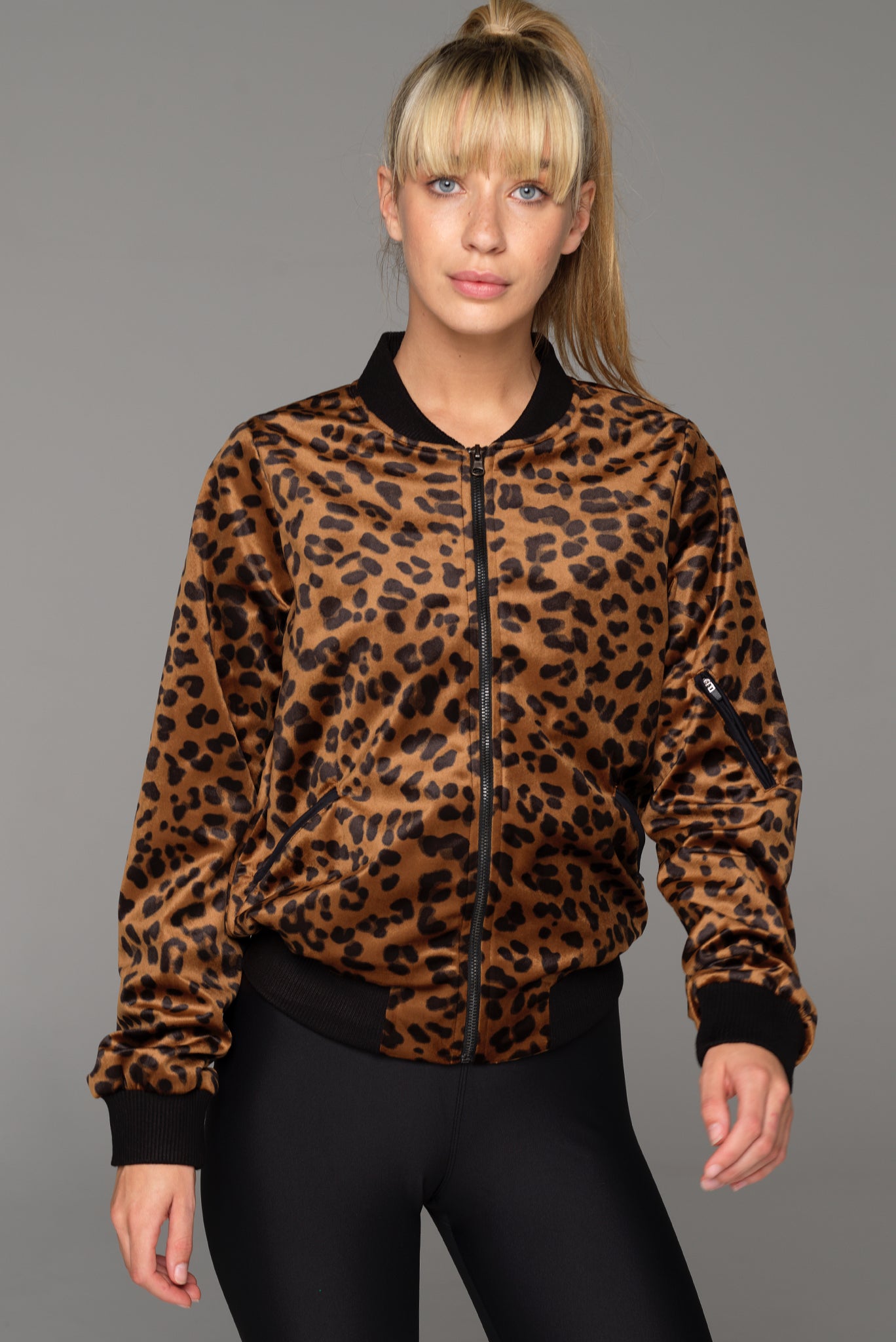 Front view of the Roam Bomber Jacket in Bronzed Baby. Zip through at front and pockets at sides, the Roam jacket combines black ribbed panels and a zipper in the left arm for a contemporary edge.